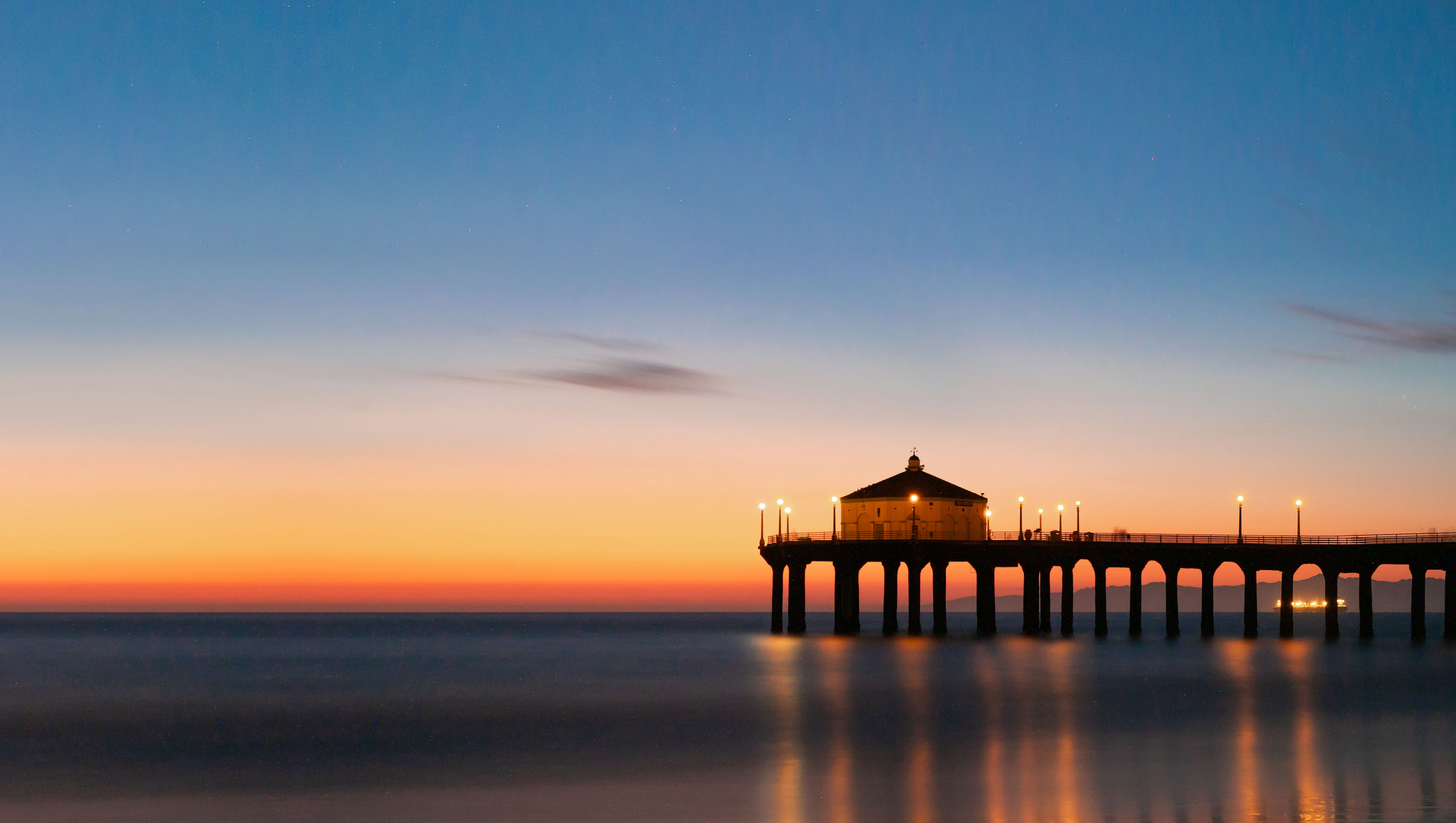 The Manhattan Beach Pier and Roundhouse at sunset.