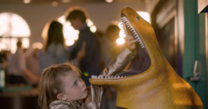 Young Girl Touching An Eel Sculpture In Roundhouse Aquarium